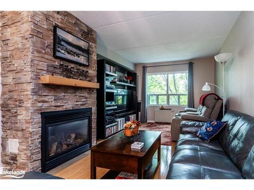 307-54 Fittons Road W, Orillia, ON - Indoor Photo Showing Living Room With Fireplace