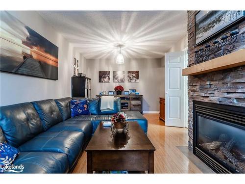 307-54 Fittons Road W, Orillia, ON - Indoor Photo Showing Living Room With Fireplace