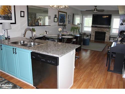 107-3 Brandy Lane Drive, Collingwood, ON - Indoor Photo Showing Kitchen With Fireplace With Double Sink