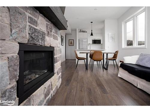 206-21 Beckwith Lane, The Blue Mountains, ON - Indoor Photo Showing Living Room With Fireplace