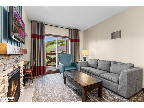 432-152 Jozo Weider Boulevard, The Blue Mountains, ON - Indoor Photo Showing Living Room With Fireplace