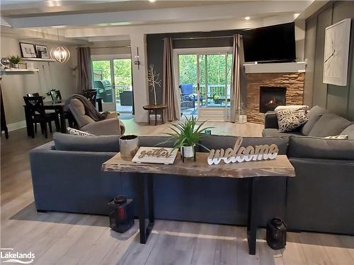 174 Vacation Inn Drive, Collingwood, ON - Indoor Photo Showing Living Room With Fireplace