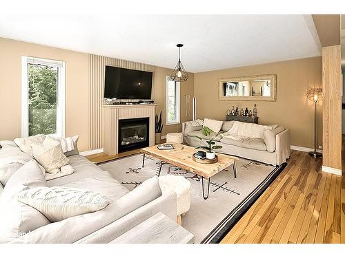 136 Maple Lane, The Blue Mountains, ON - Indoor Photo Showing Living Room With Fireplace