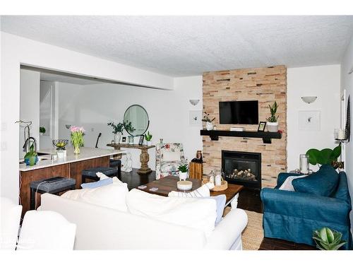 13-68 Webb Circle, Haliburton, ON - Indoor Photo Showing Living Room With Fireplace