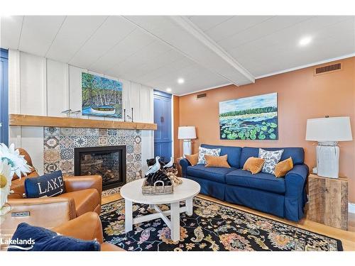 106-10 Coveside Drive, Huntsville, ON - Indoor Photo Showing Living Room With Fireplace