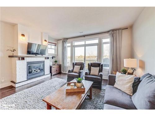 202-115 Fairway Court, Town Of Blue Mountains, ON - Indoor Photo Showing Living Room With Fireplace