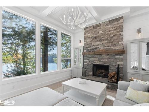 27 Playfair Island, Seguin, ON - Indoor Photo Showing Living Room With Fireplace