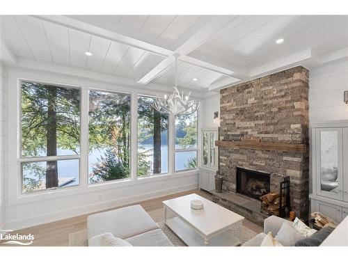 27 Playfair Island, Seguin, ON - Indoor Photo Showing Living Room With Fireplace