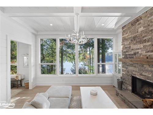 27 Playfair Island, Seguin, ON - Indoor Photo Showing Living Room With Fireplace