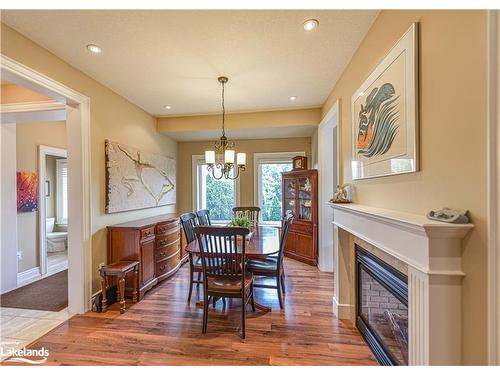 1-10 Invermara Court, Orillia, ON - Indoor Photo Showing Dining Room With Fireplace