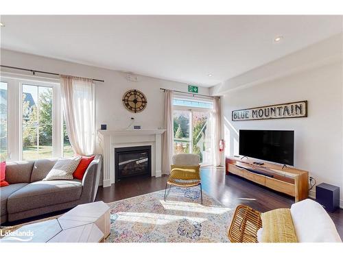 31-171 Snowbridge Way, The Blue Mountains, ON - Indoor Photo Showing Living Room With Fireplace