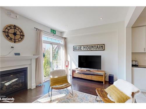 31-171 Snowbridge Way, The Blue Mountains, ON - Indoor Photo Showing Living Room With Fireplace