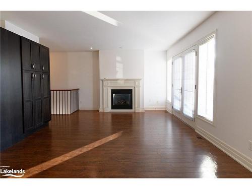 4-64 River Road E, Wasaga Beach, ON - Indoor Photo Showing Living Room With Fireplace