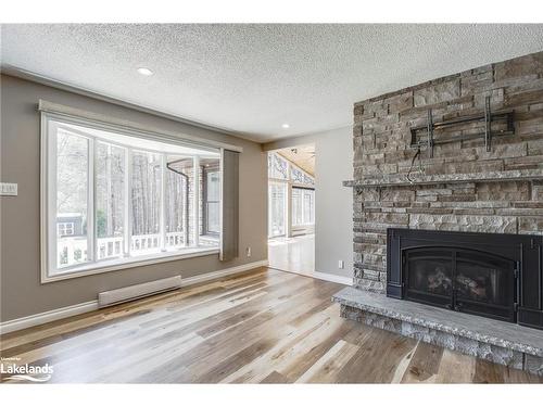 61 Beaufort Crescent, Tiny, ON - Indoor Photo Showing Living Room With Fireplace