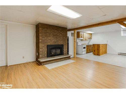 61 Beaufort Crescent, Tiny, ON - Indoor Photo Showing Living Room With Fireplace