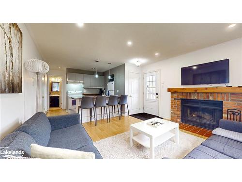 101-23 Dawson Drive, Collingwood, ON - Indoor Photo Showing Living Room With Fireplace