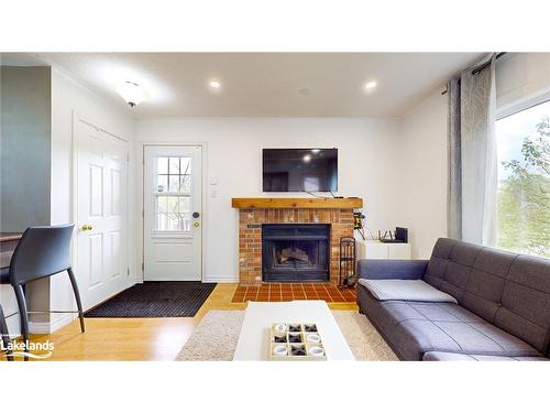 101-23 Dawson Drive, Collingwood, ON - Indoor Photo Showing Living Room With Fireplace