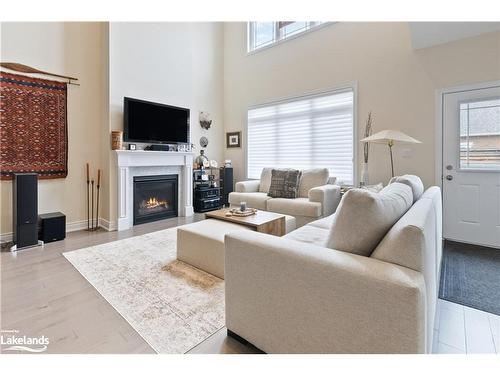 22 Emerson Mews, Collingwood, ON - Indoor Photo Showing Living Room With Fireplace