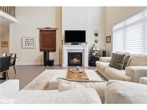 22 Emerson Mews, Collingwood, ON - Indoor Photo Showing Living Room With Fireplace