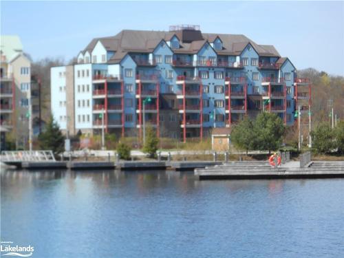 208-130 Steamship Bay Road, Gravenhurst, ON - Outdoor With Body Of Water With Balcony With Facade