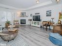 208-130 Steamship Bay Road, Gravenhurst, ON  - Indoor Photo Showing Living Room With Fireplace 