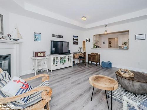 208-130 Steamship Bay Road, Gravenhurst, ON - Indoor Photo Showing Living Room With Fireplace