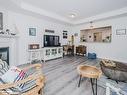 208-130 Steamship Bay Road, Gravenhurst, ON  - Indoor Photo Showing Living Room With Fireplace 