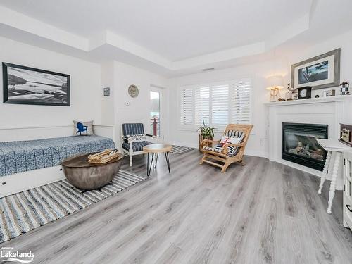 208-130 Steamship Bay Road, Gravenhurst, ON - Indoor Photo Showing Living Room With Fireplace