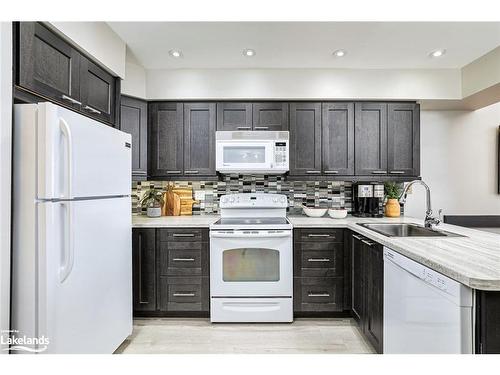 202-796404 19 Grey Road, The Blue Mountains, ON - Indoor Photo Showing Kitchen