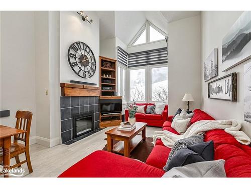 202-796404 19 Grey Road, The Blue Mountains, ON - Indoor Photo Showing Living Room With Fireplace