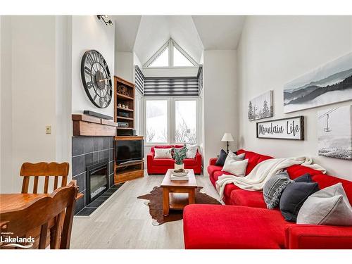 202-796404 19 Grey Road, The Blue Mountains, ON - Indoor Photo Showing Living Room With Fireplace