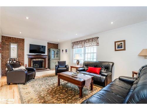 140 Wolfe Trail, Tiny, ON - Indoor Photo Showing Living Room With Fireplace