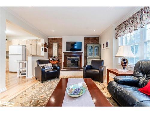 140 Wolfe Trail, Tiny, ON - Indoor Photo Showing Living Room With Fireplace