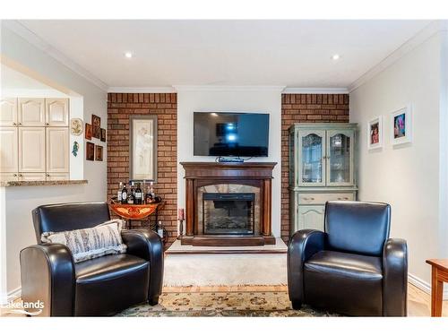 140 Wolfe Trail, Tiny, ON - Indoor Photo Showing Living Room With Fireplace