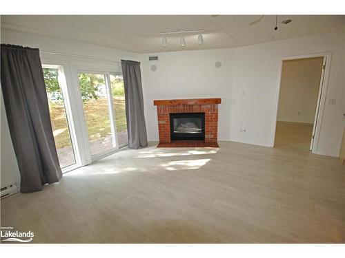 153-53 Trott Boulevard, Collingwood, ON - Indoor Photo Showing Living Room With Fireplace