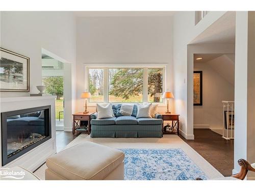 2-15 Golf Course Road, Bracebridge, ON - Indoor Photo Showing Living Room With Fireplace