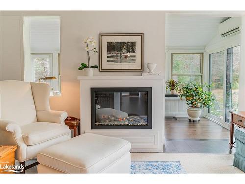 2-15 Golf Course Road, Bracebridge, ON - Indoor Photo Showing Living Room With Fireplace