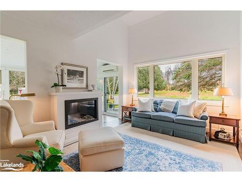 2-15 Golf Course Road, Bracebridge, ON - Indoor Photo Showing Living Room With Fireplace