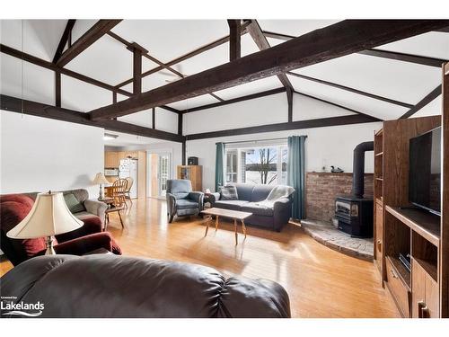 327 Whitestone Lake Road, Whitestone, ON - Indoor Photo Showing Living Room With Fireplace