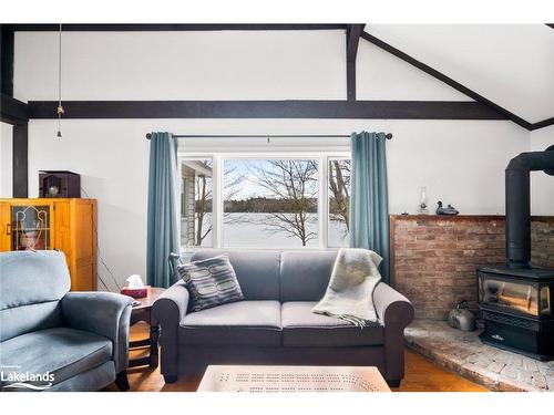 327 Whitestone Lake Road, Whitestone, ON - Indoor Photo Showing Living Room With Fireplace