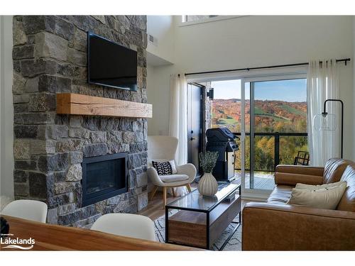 406-16 Beckwith Lane, The Blue Mountains, ON - Indoor Photo Showing Living Room With Fireplace