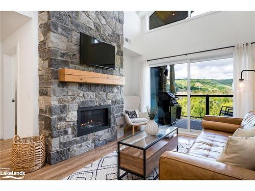 406-16 Beckwith Lane, The Blue Mountains, ON - Indoor Photo Showing Living Room With Fireplace