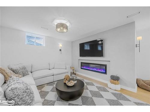 28 Atlantis Drive, Orillia, ON - Indoor Photo Showing Living Room With Fireplace