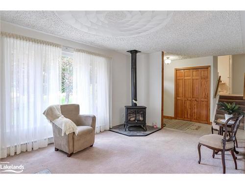 80 Hubbel Crescent, Huntsville, ON - Indoor Photo Showing Living Room With Fireplace