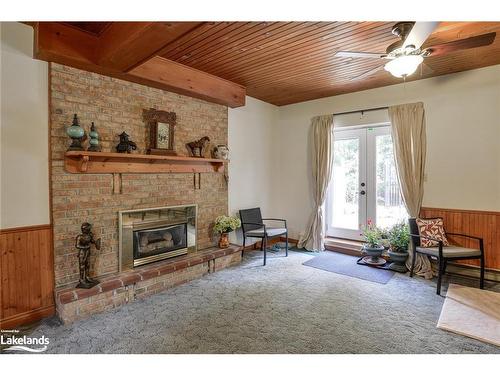 80 Hubbel Crescent, Huntsville, ON - Indoor Photo Showing Living Room With Fireplace