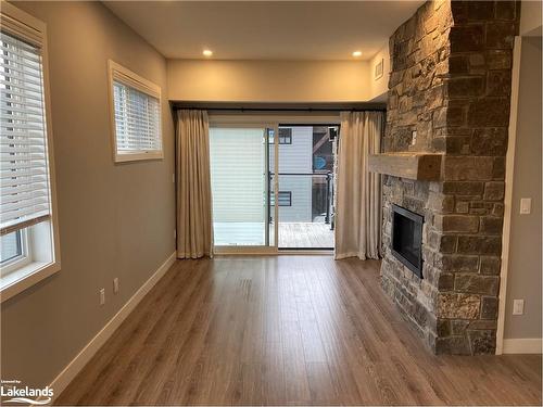 302-11 Beckwith Lane, The Blue Mountains, ON - Indoor Photo Showing Other Room With Fireplace