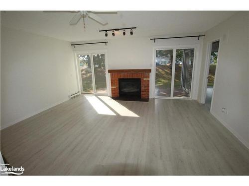 151-53 Trott Boulevard, Collingwood, ON - Indoor Photo Showing Living Room With Fireplace