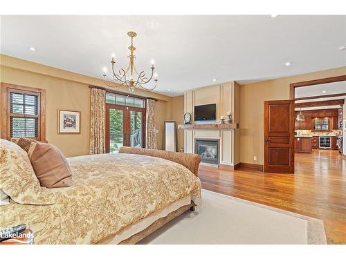 148 Snowbridge Way, The Blue Mountains, ON - Indoor Photo Showing Bedroom With Fireplace