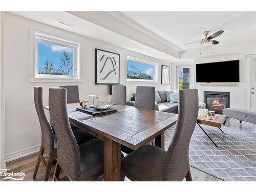 101-4 Anchorage Crescent, Collingwood, ON - Indoor Photo Showing Dining Room With Fireplace