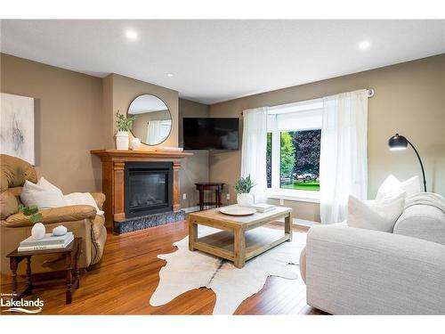 84 Wasaga Sands Drive, Wasaga Beach, ON - Indoor Photo Showing Living Room With Fireplace